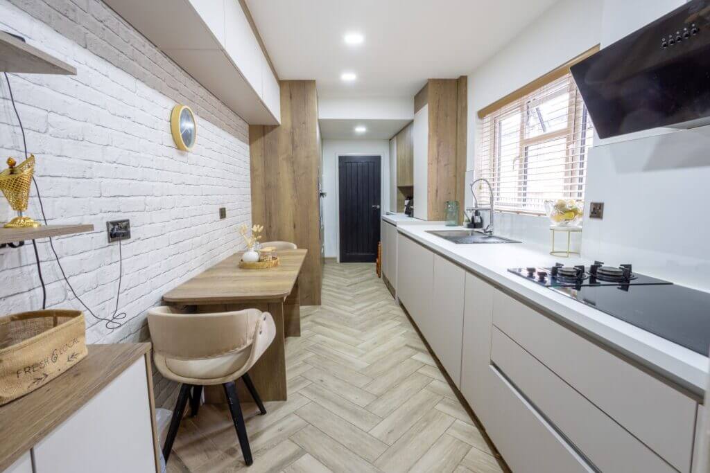 a kitchen with a table and chairs